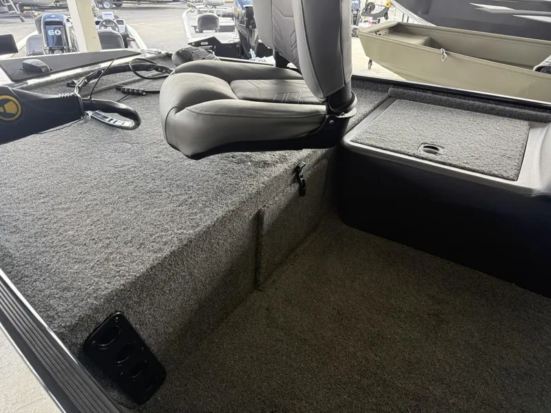 Slide: The Image of 2025 Tracker Bass Tracker Classic XL interior with seating and storage compartments. - 7