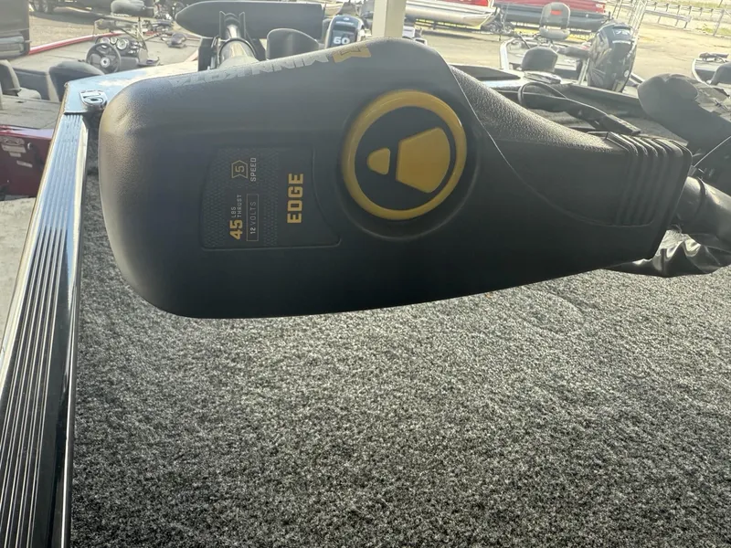 Slide: The Image of 2025 Tracker Bass Tracker Classic XL boat with Edge trolling motor on carpeted deck. - 8