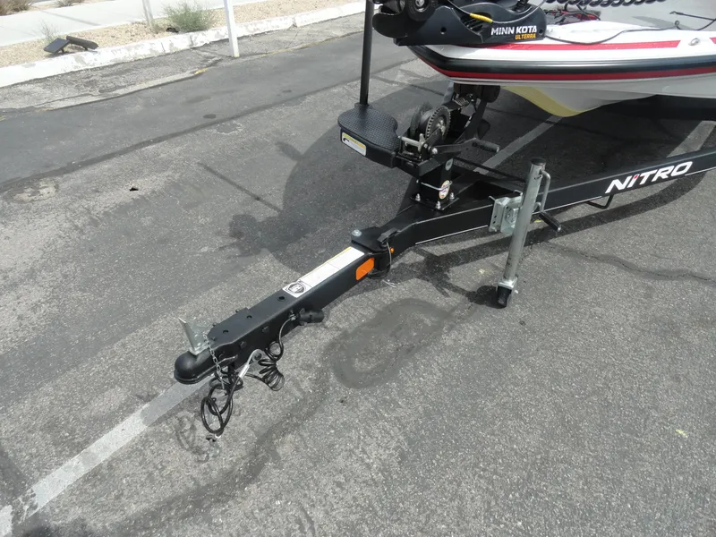 Slide: The Image of Trailer hitch of a 2018 Nitro Z17 boat on asphalt pavement. - 22