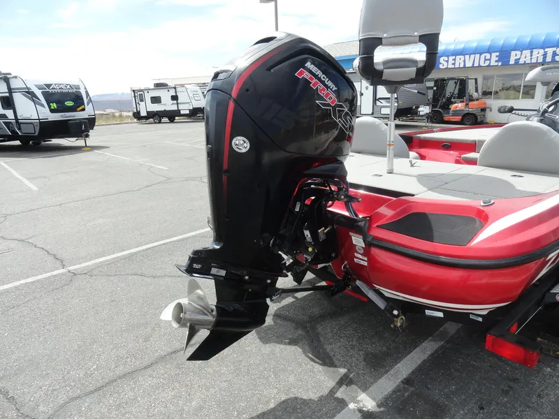 Slide: The Image of 2018 Nitro Z17 boat with powerful outboard motor in a parking lot. - 25