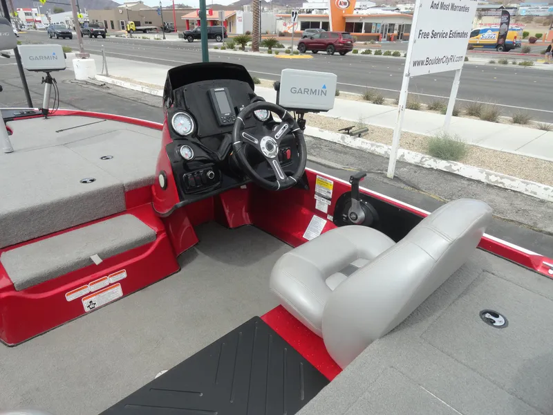 Slide: The Image of 2018 Nitro Z17 boat interior with steering wheel and Garmin navigation system. - 8