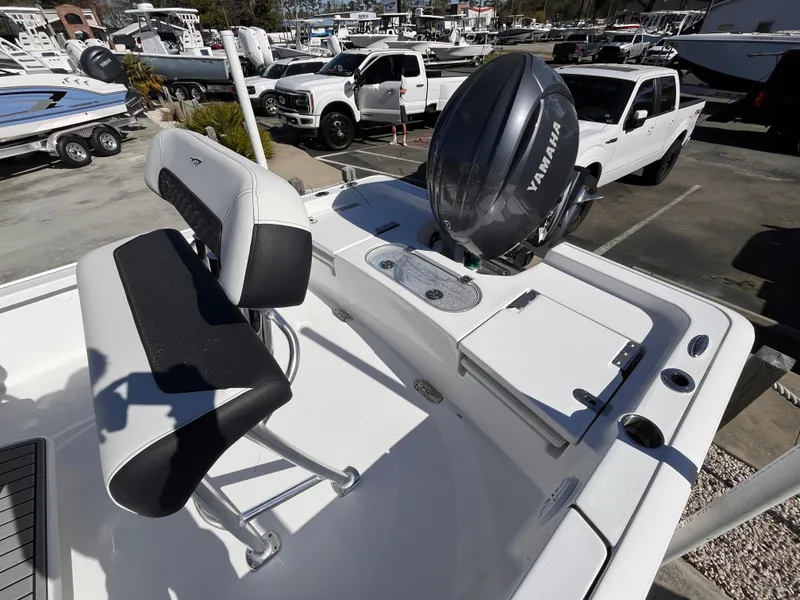 Slide: The Image of 2025 Tidewater 2110 Bay Max boat with Yamaha engine in a marina setting. - 11