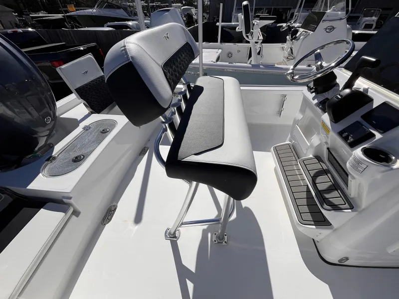 Slide: The Image of 2025 Tidewater 2110 Bay Max boat interior with seating and steering console. - 5