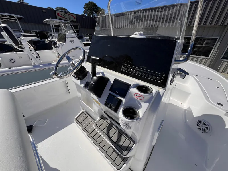 Slide: The Image of 2025 Tidewater 2110 Bay Max boat console with steering wheel and controls. - 6