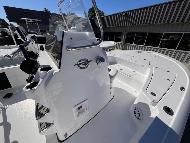 Slide: The Image of 2025 Tidewater 2110 Bay Max boat interior with console and seating area. - 7