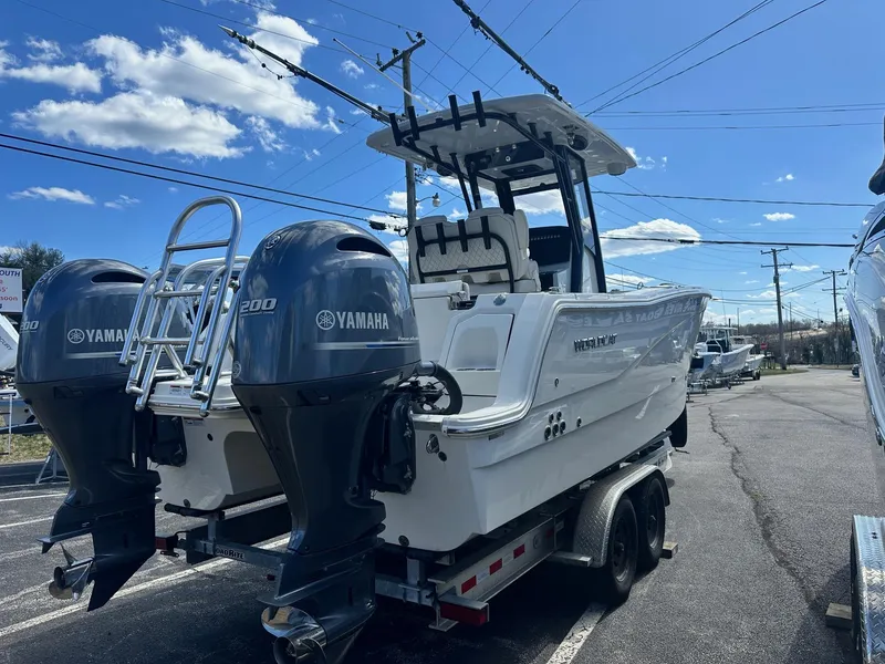 Slide: The Image of 2023 World Cat 260 CC-X boat with dual Yamaha engines on a trailer. - 1