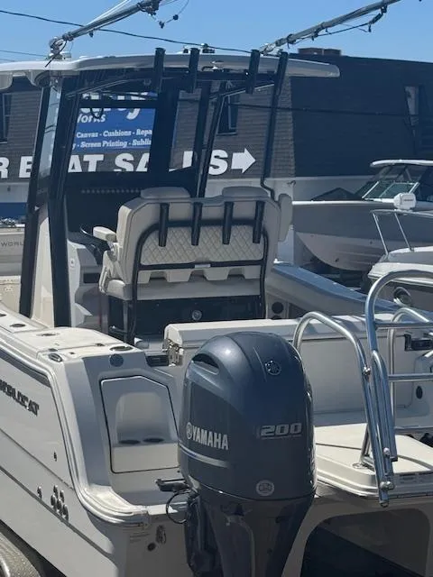 Slide: The Image of 2023 World Cat 260 CC-X boat with Yamaha 200 engine, displayed at a sales lot. - 10