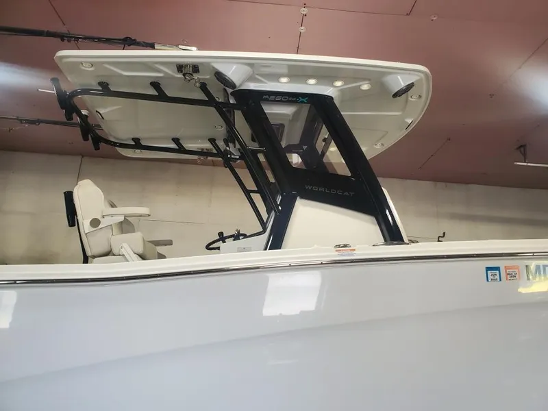 Slide: The Image of 2023 World Cat 260 CC-X boat with T-top and seating, indoor view. - 13