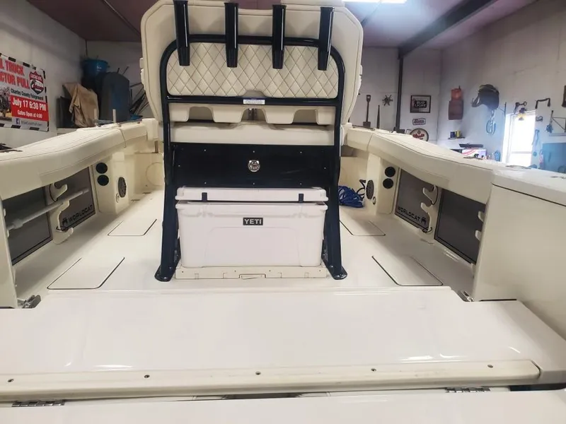 Slide: The Image of 2023 World Cat 260 CC-X boat interior with Yeti cooler and spacious seating. - 16
