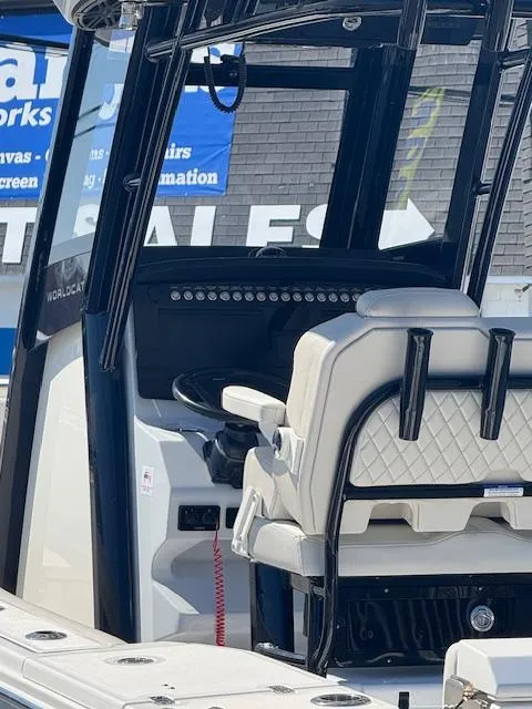 Slide: The Image of 2023 World Cat 260 CC-X boat interior with helm and seating. - 18