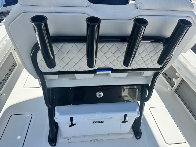 Slide: The Image of 2023 World Cat 260 CC-X boat interior with rod holders and cooler. - 20