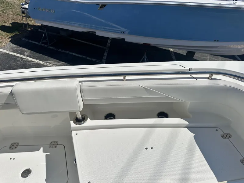 Slide: The Image of 2023 World Cat 260 CC-X boat interior with seating and storage compartments. - 29