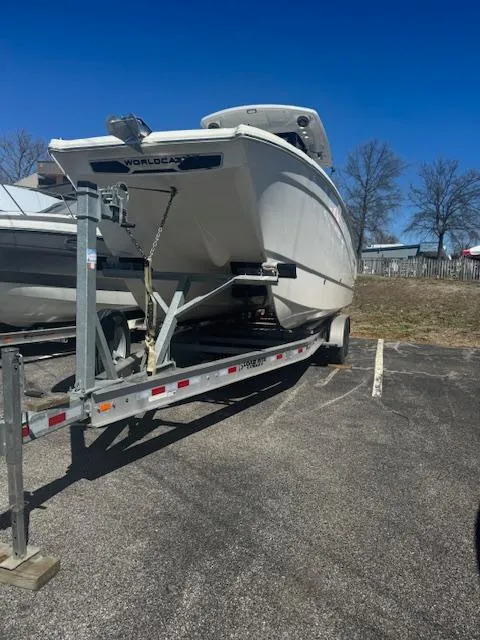 Slide: The Image of 2023 World Cat 260 CC-X boat on trailer, parked outdoors. - 6