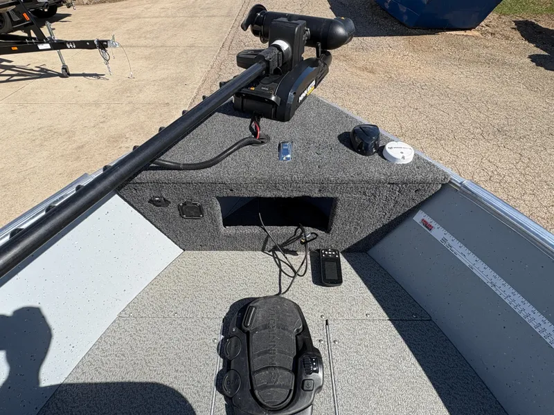 Slide: The Image of 2021 Lund 1600 Fury Tiller boat interior with trolling motor and control panel. - 10