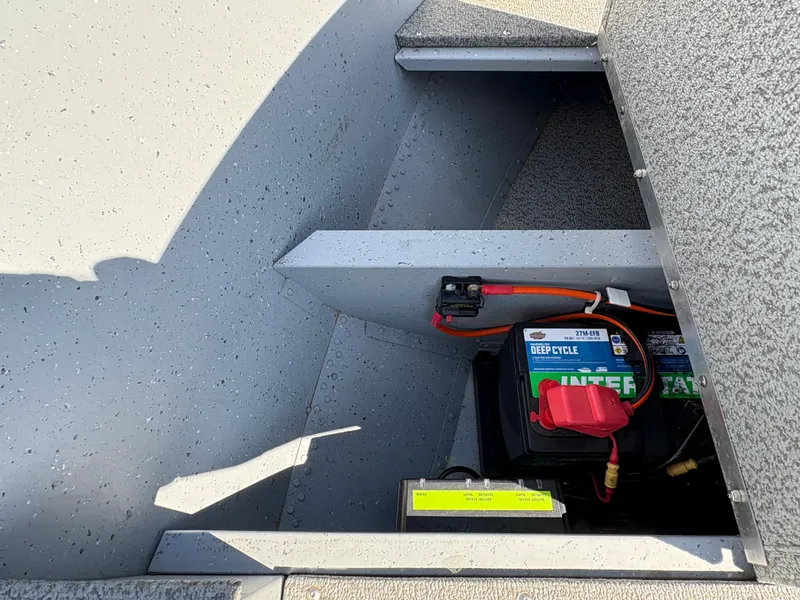 Slide: The Image of 2021 Lund 1600 Fury Tiller boat battery compartment with deep cycle battery. - 12