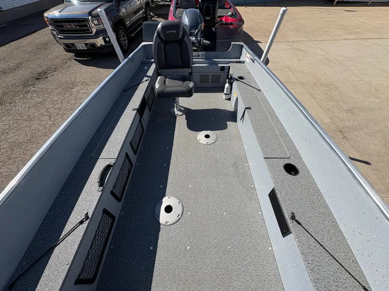 Slide: The Image of 2021 Lund 1600 Fury Tiller boat interior with seating and storage compartments. - 15
