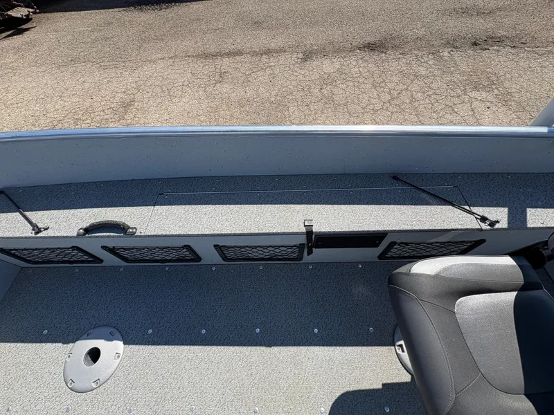 Slide: The Image of 2021 Lund 1600 Fury Tiller boat interior with seating and storage compartments. - 16