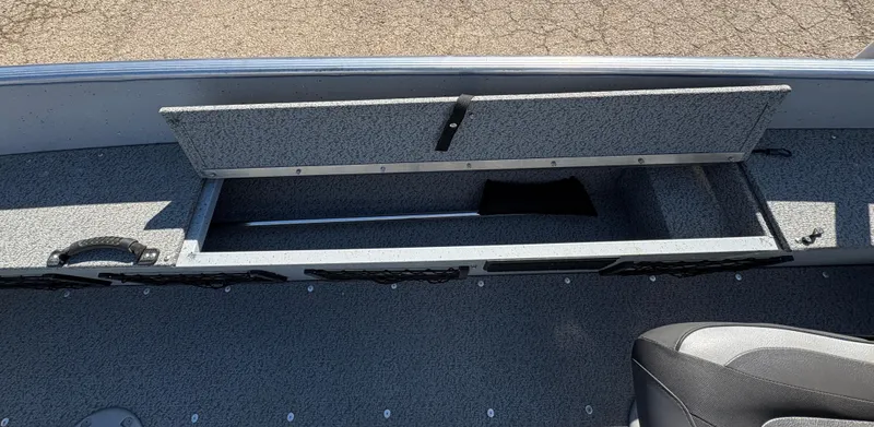 Slide: The Image of 2021 Lund 1600 Fury Tiller boat interior with open storage compartment. - 17