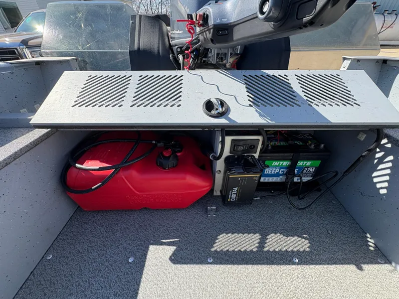 Slide: The Image of 2021 Lund 1600 Fury Tiller boat interior with fuel tank and battery storage. - 22