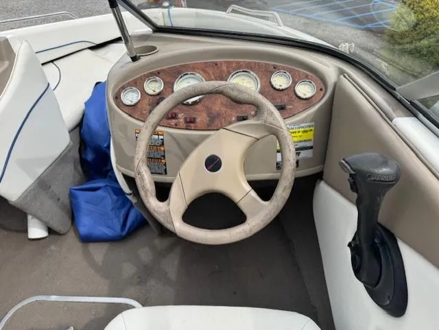 Slide: The Image of 2005 Bayliner 195 Bowrider dashboard with steering wheel and instrument panel. - 5