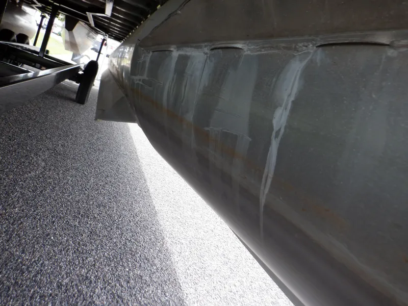 Slide: The Image of 2013 Harris FloteBote Cruiser 240 pontoon underside on trailer. - 12