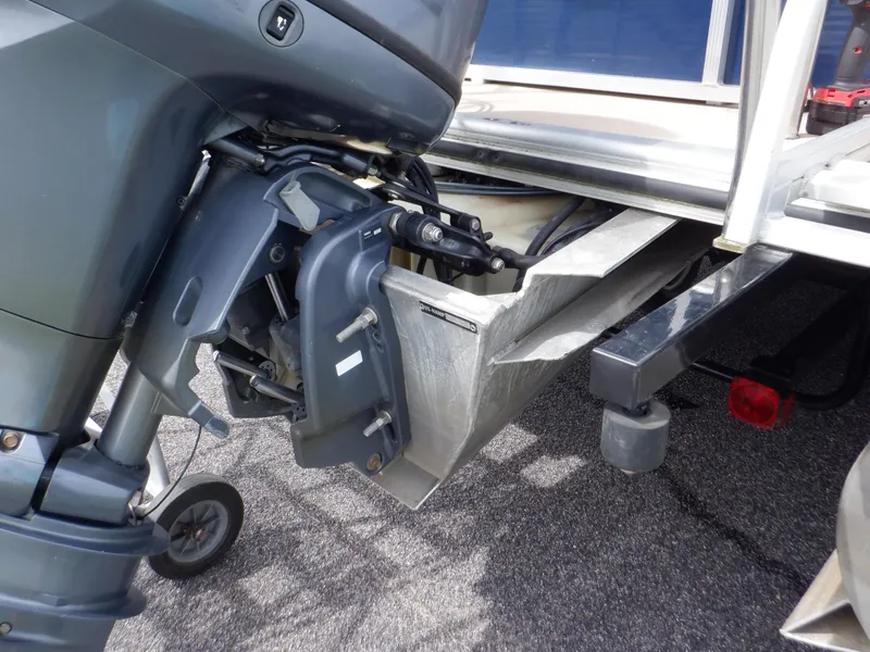 Slide: The Image of 2013 Harris FloteBote Cruiser 240 outboard motor and pontoon detail. - 26