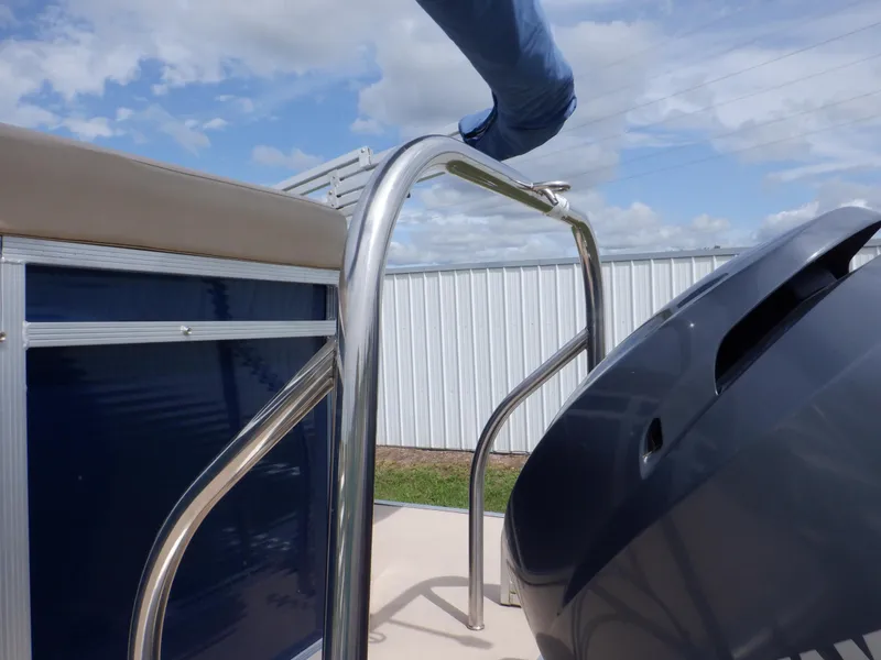 Slide: The Image of 2013 Harris FloteBote Cruiser 240 pontoon boat with stainless steel railing and motor. - 28