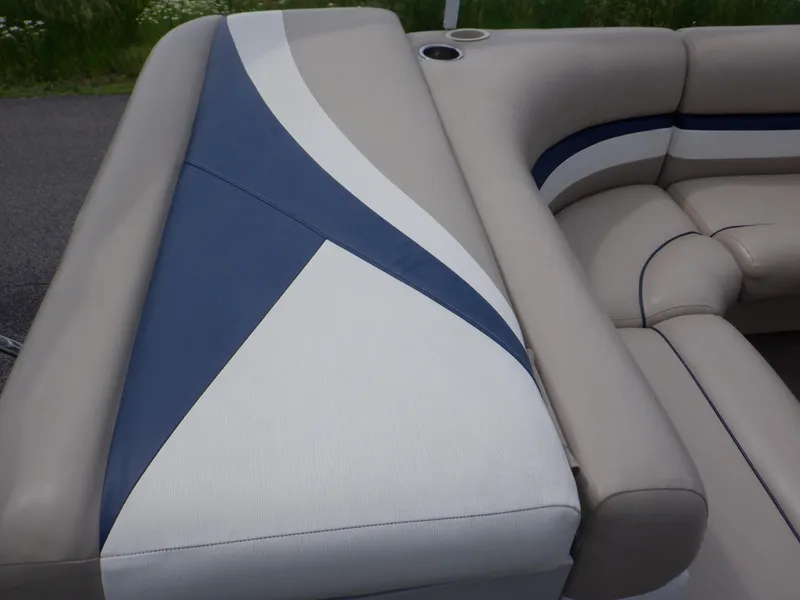 Slide: The Image of 2013 Harris FloteBote Cruiser 240 interior seating with blue and white upholstery. - 30