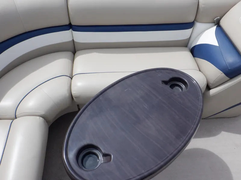 Slide: The Image of 2013 Harris FloteBote Cruiser 240 interior with beige seating and oval table. - 34