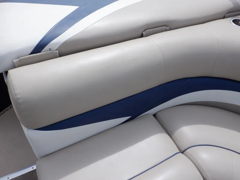 Slide: The Image of 2013 Harris FloteBote Cruiser 240 boat seating with beige and blue upholstery. - 36