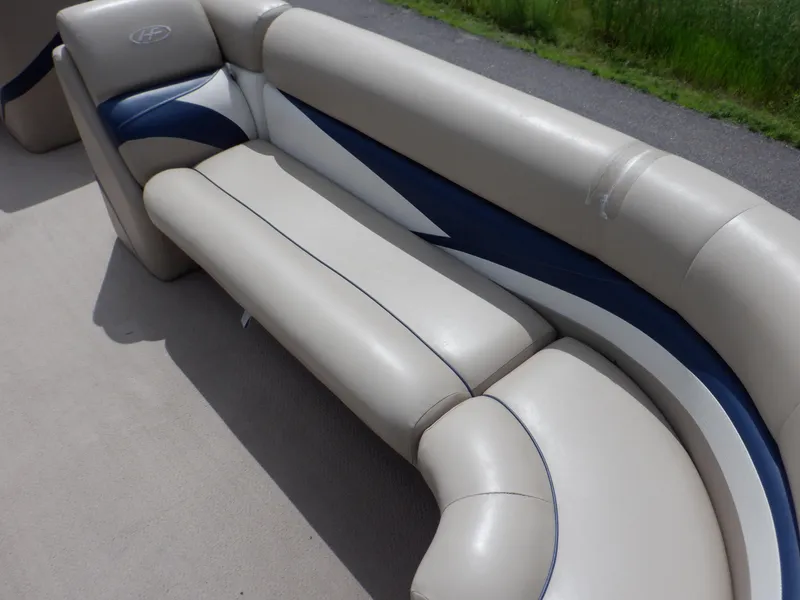 Slide: The Image of 2013 Harris FloteBote Cruiser 240 boat seating, beige and blue upholstery. - 39