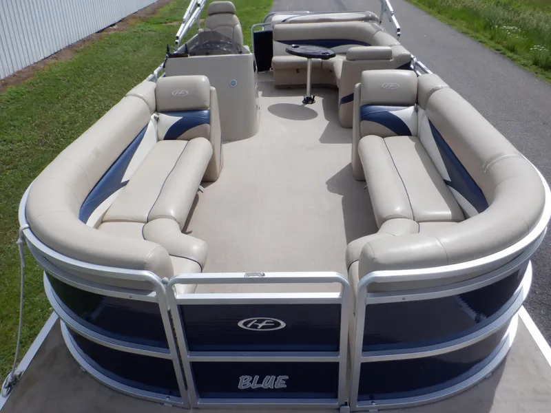 Slide: The Image of 2013 Harris FloteBote Cruiser 240 pontoon boat with spacious seating and modern design. - 4