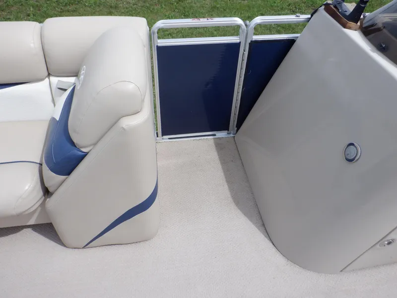 Slide: The Image of 2013 Harris FloteBote Cruiser 240 interior with beige seating and blue accents. - 48