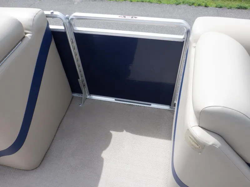 Slide: The Image of 2013 Harris FloteBote Cruiser 240 interior seating with blue and beige upholstery. - 49