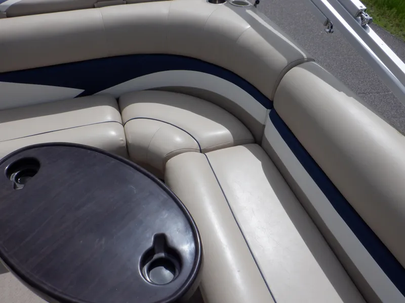 Slide: The Image of Luxurious seating on 2013 Harris FloteBote Cruiser 240 with table and cup holders. - 50