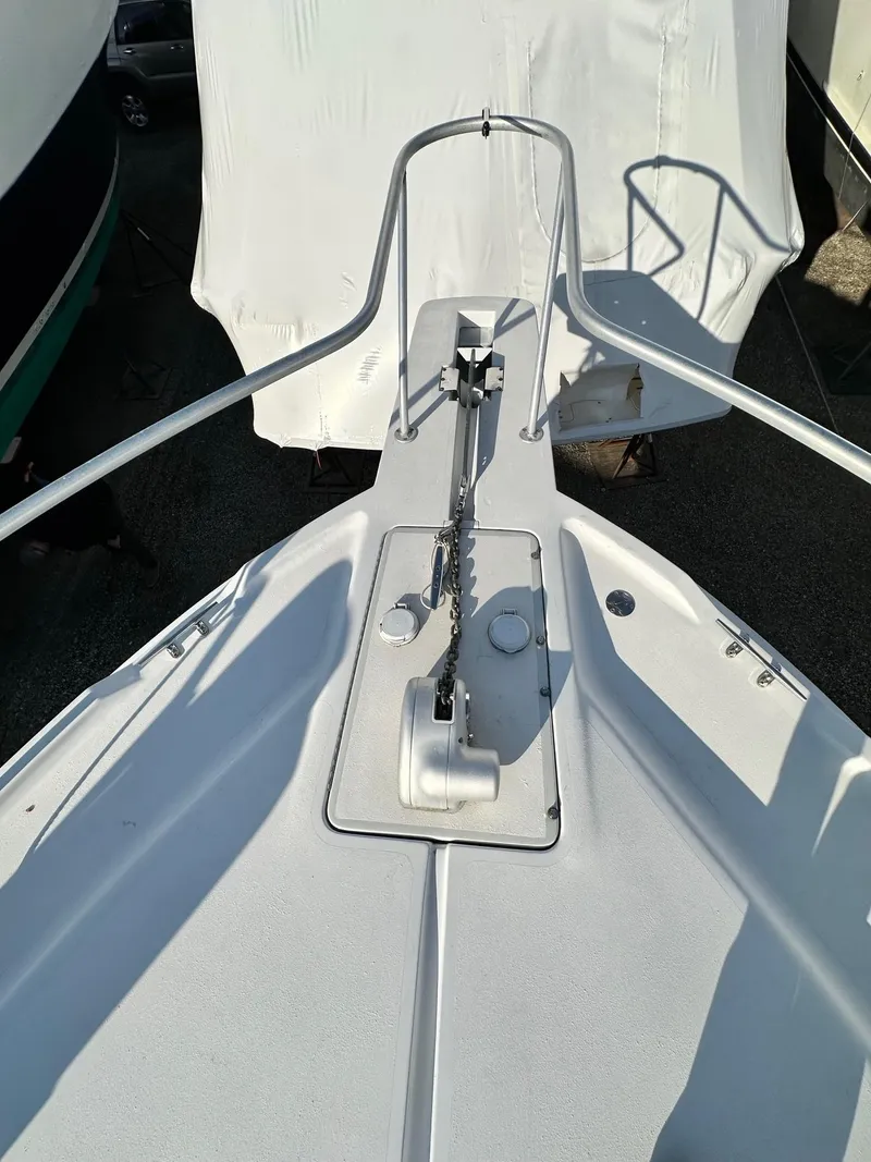 Slide: The Image of Bow view of 1996 Mainship 40 Sedan Bridge with anchor chain and railing. - 24