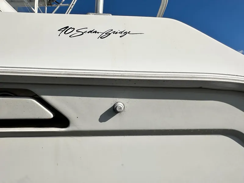 Slide: The Image of 1996 Mainship 40 Sedan Bridge boat exterior with model name visible. - 6