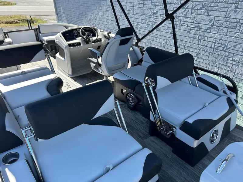 Slide: The Image of 2025 Avalon LSZ 2185 Quad Lounger Shift interior with modern seating and helm. - 8