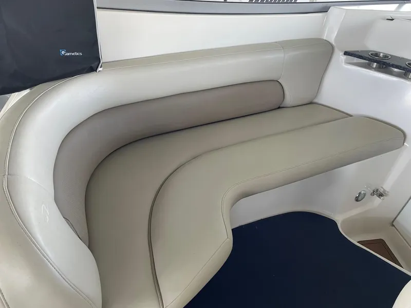Slide: The Image of 2005 Regal 2860 Express Cruiser interior seating with beige upholstery. - 9