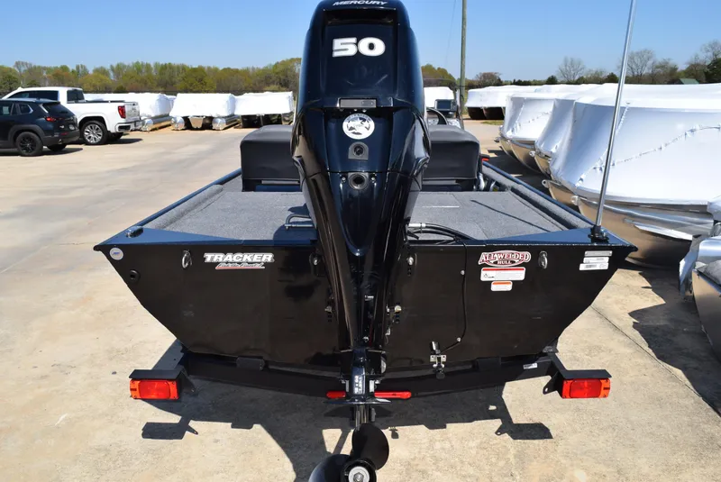 Slide: The Image of 2022 Tracker Bass Tracker Classic XL boat with 50 HP engine, parked outdoors. - 10