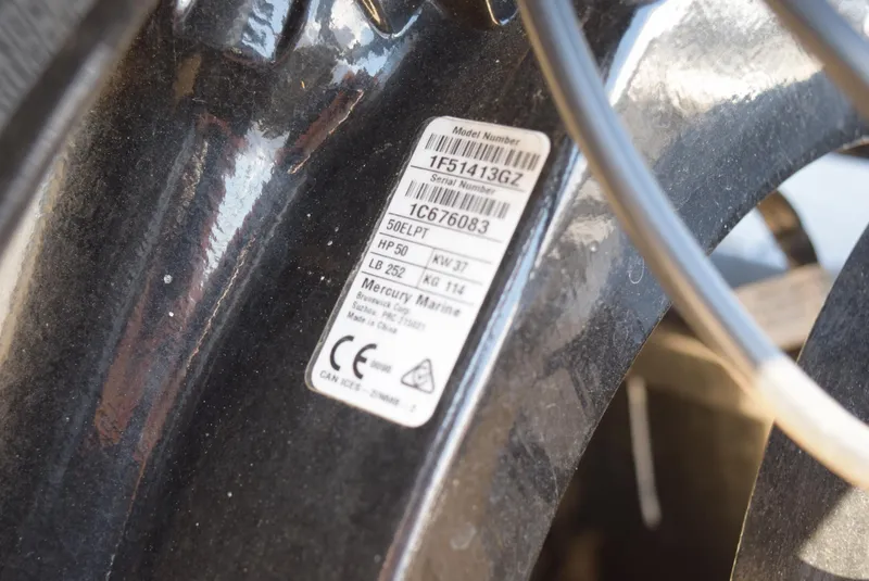 Slide: The Image of 2022 Tracker Bass Tracker Classic XL engine label with specifications and serial number. - 13