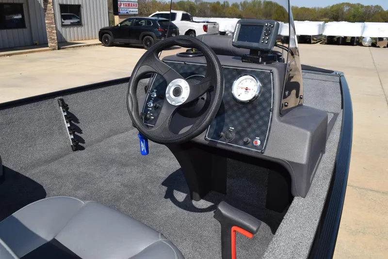 Slide: The Image of 2022 Tracker Bass Tracker Classic XL boat dashboard with steering wheel and gauges. - 6