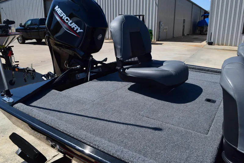 Slide: The Image of 2022 Tracker Bass Tracker Classic XL boat with Mercury engine and cushioned seating. - 7