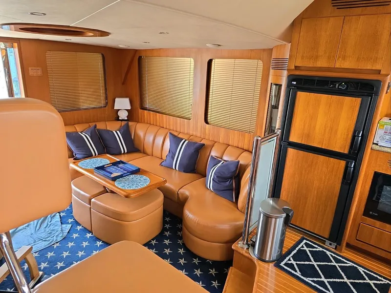 Slide: The Image of Luxurious interior of 2005 Ocean Alexander 52 Sedan yacht with leather seating and wooden finishes. - 10