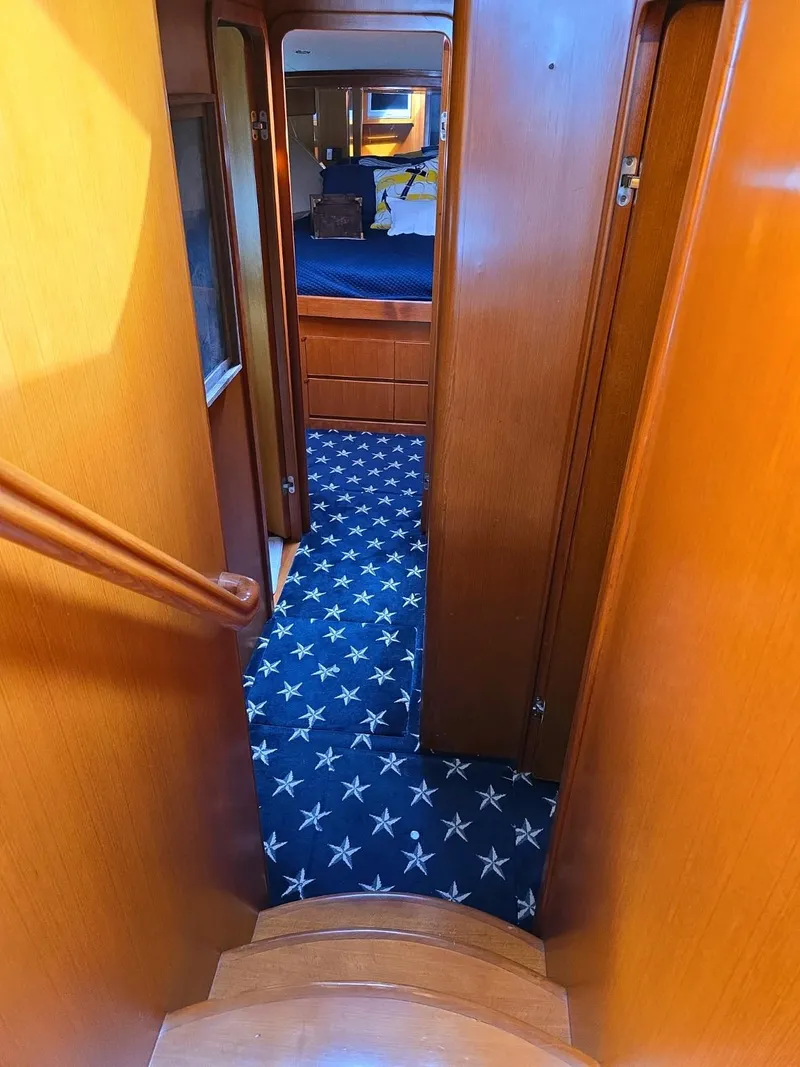 Slide: The Image of Interior hallway of 2005 Ocean Alexander 52 Sedan with star-patterned carpet. - 15