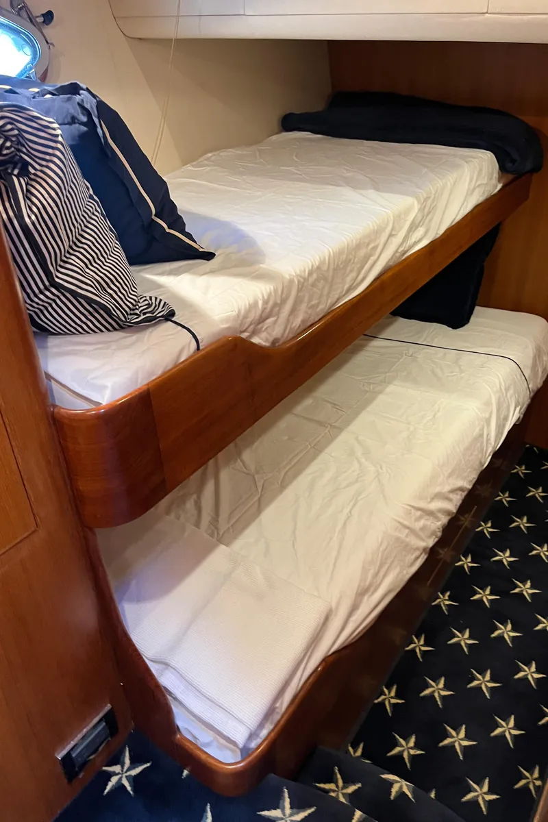 Slide: The Image of Bunk beds in 2005 Ocean Alexander 52 Sedan yacht cabin with star-patterned carpet. - 21