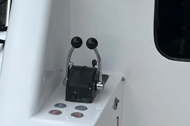 Slide: The Image of Throttle controls on a 2005 Ocean Alexander 52 Sedan yacht dashboard. - 34