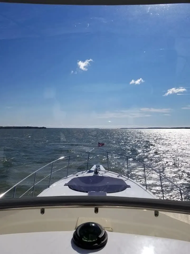 Slide: The Image of Ocean Alexander 52 Sedan cruising on open water under a clear blue sky, 2005 model. - 4