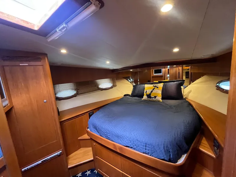 Slide: The Image of Luxurious cabin interior of 2005 Ocean Alexander 52 Sedan yacht with cozy bedding. - 8