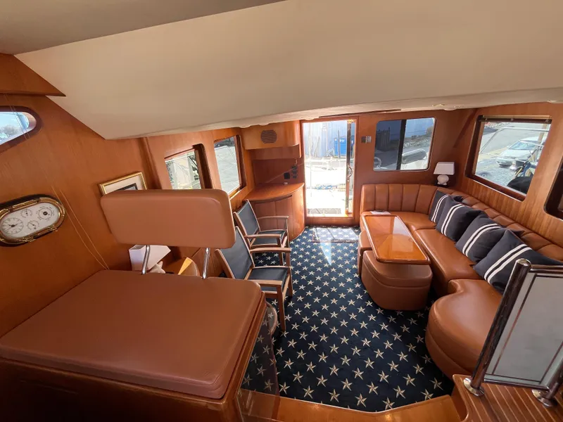 Slide: The Image of Luxurious interior of a 2005 Ocean Alexander 52 Sedan yacht with elegant seating and nautical decor. - 9
